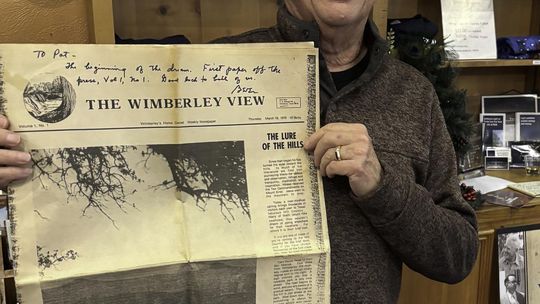 Submitted Photo Dr. Patrick Cox with the first edition of the Wimberley View.