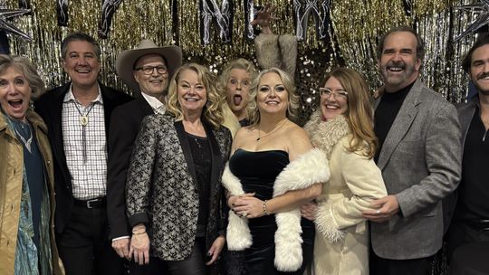 Posing after the performance are HCHC writers and performers: Monica Michell, Bruce Levinson, David Bisett, Roxanne Strobel, Carla Daws, Molly Poorboy, Reji Smith, Danny Mosier and Samuel Ellisor. Photo by Teresa Kendrick