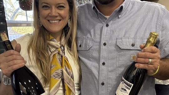 Jaclynn van Sant Downes and Justin Downes at the grand opening of the Jaclynn Renée Wine Collective in the former Social on the Square space. Photo by Teresa Kendrick