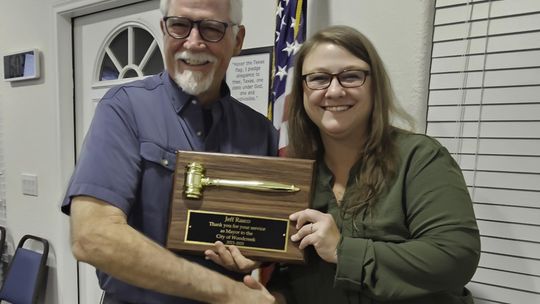 Submitted Photo Outgoing Mayor of Woodcreek Jeff Rasco receives an award for his service to Woodcreek. He is shown here receiving a gavel plaque from incoming Mayor Debra Hines.