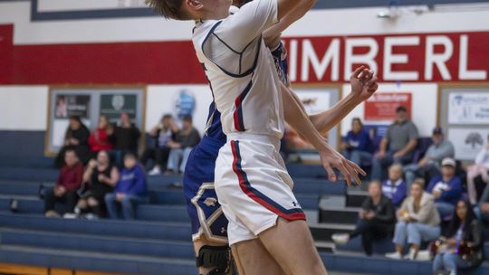 Photo by Julie Albini/albini.smugmug.com Nathan Baker makes the shot and draws the foul.