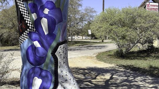 Sporting fresh mosaic tiles, the Boot outside the Wimberley Pharmacy has been restored by JoDee BEnson. Photo by Teresa Kendrick