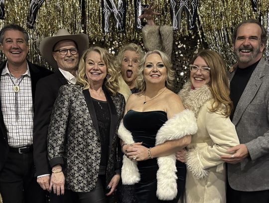 Posing after the performance are HCHC writers and performers: Monica Michell, Bruce Levinson, David Bisett, Roxanne Strobel, Carla Daws, Molly Poorboy, Reji Smith, Danny Mosier and Samuel Ellisor. Photo by Teresa Kendrick
