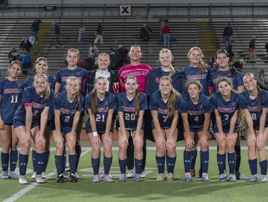 Photo by Julie Albini/albini.smugmug.com Lady Texans pose for team picture after their victory over Marble Falls.