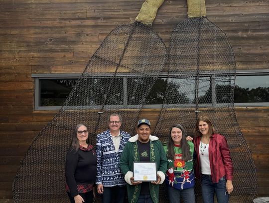 Photo by Lindsey Deringer Taking the Winter Wonderland award was The Leaning Pear. Decorators include Kathy Locke, left, Matthew Buchanan, Adrian Casteñeda, Rachel Buchanan and Linda Swift.