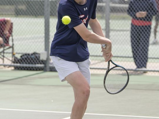 Marcus Gonzales serves at the Pflugerville Connally Cougar Classic in Gonzales and teammate Banton Kirchner won first place in Boys Doubles.  Photo by Julie Albini/albini.smugmug.com