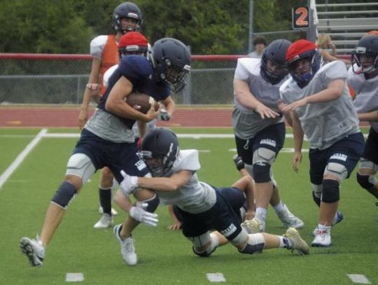 Texan football preps for  Davenport scrimmage