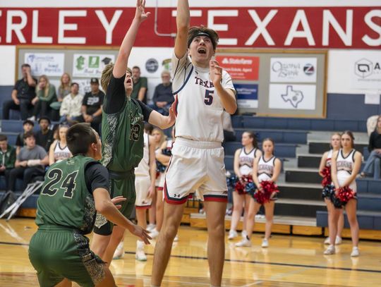 Photo by Julie Albini/albini.smugmug.com Nathan Baker, #5, up for the shot to defeat Canyon lake.