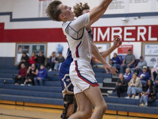 Photo by Julie Albini/albini.smugmug.com Nathan Baker makes the shot and draws the foul.