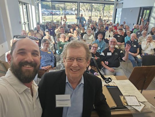 Photo by Dalton Sweat Regional Editor Dalton Sweat, left, Founder Dr. Patrick Cox, writers and the Wimberley community celebrate the 50th anniversary of the Wimberley View.