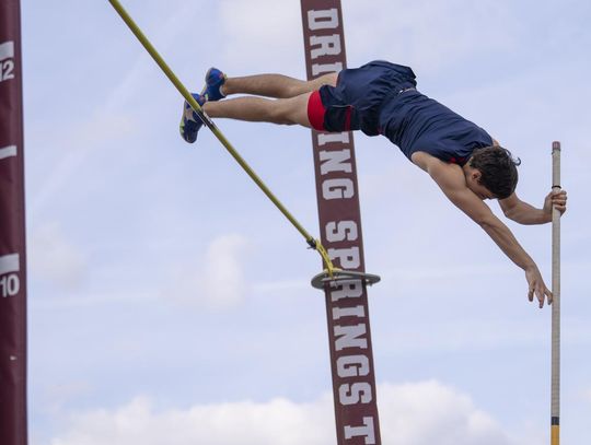 Photo by Julie Albini/albini.smugmug.com Dane Mignerey takes first place in the pole vault. 