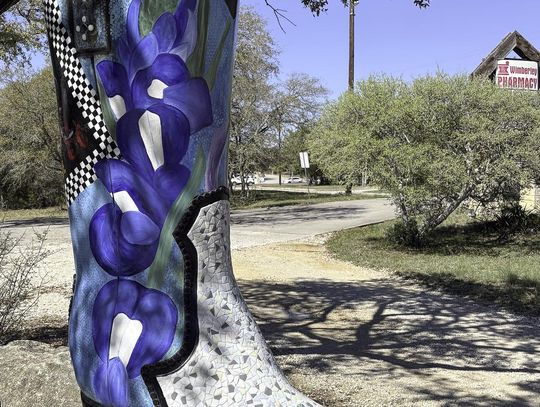 Sporting fresh mosaic tiles, the Boot outside the Wimberley Pharmacy has been restored by JoDee BEnson. Photo by Teresa Kendrick