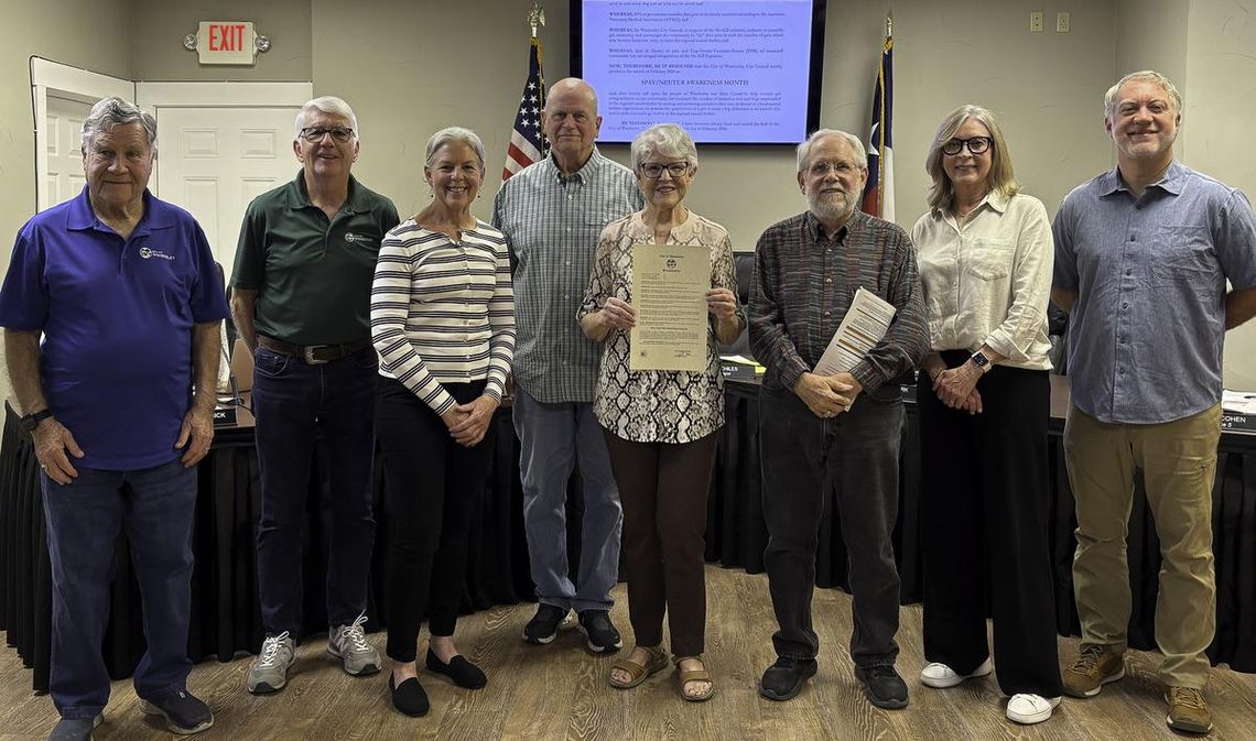 February is Spay and Neuter Awareness month Photo by Teresa Kendrick Mayor Jim Chiles recognizes the work of the Wimberley TNR program. In the Center, holding the Proclamation, is Marcia Sanderson.