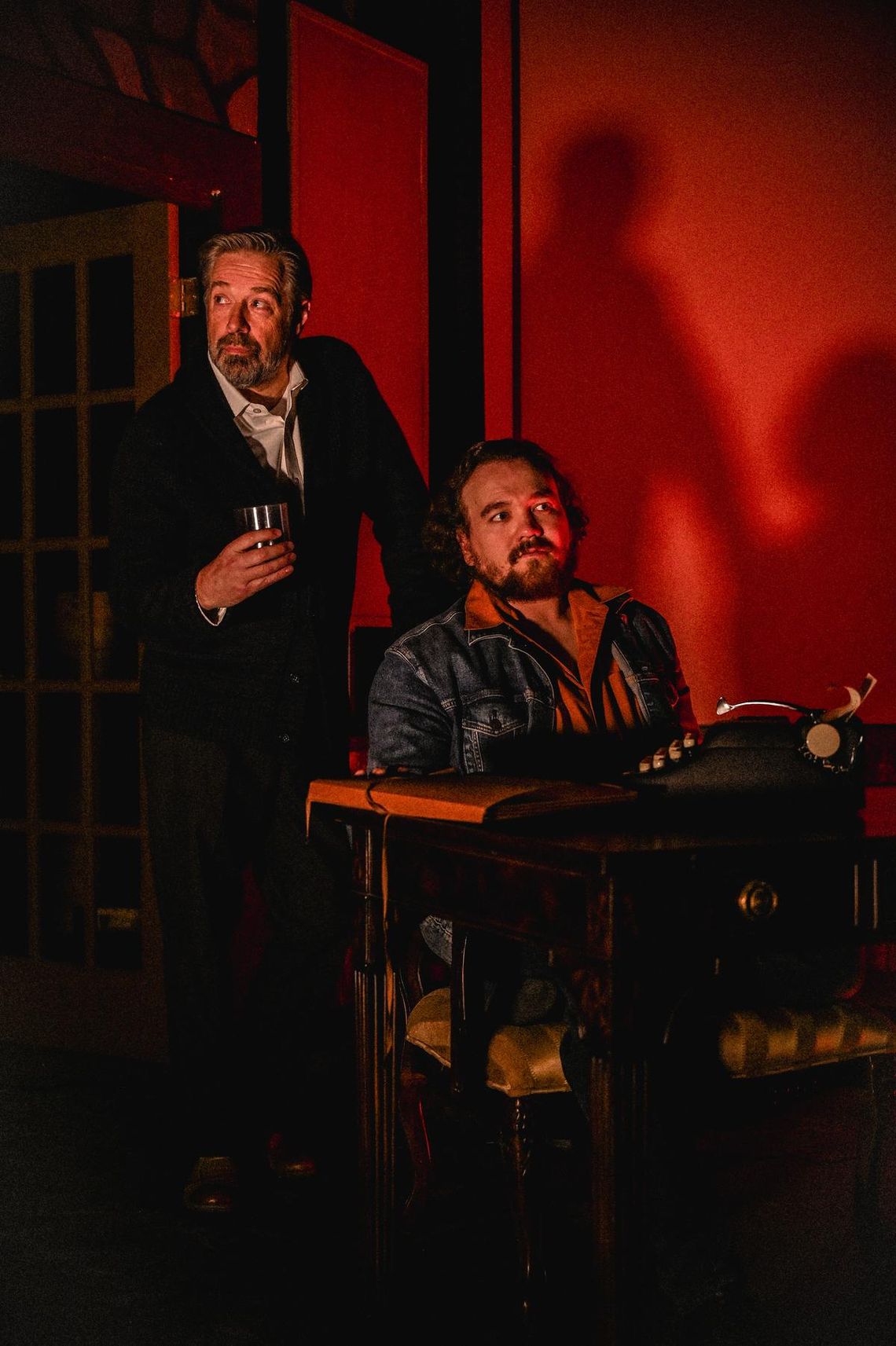 Photo by John Rodgers Deception and betrayal drive the plot twists in Deathtrap opening at the Wimberley Players theatre, February 20. Greg Baglia (standing) plays the role of Sidney, and in the role of Clifford is Taylor Lueckenotte (seated).