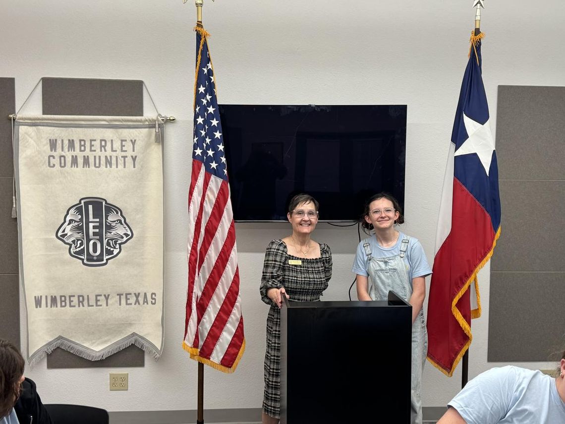 New flags fly over library Submitted Photo Wimberley Village Library Director Carolyn Manning and WC Leo President Gracie McLean.