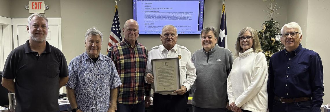 Retiring Fire Chief Czichos has his day Photo by Teresa Kendrick Retiring Fire Chief Carroll Czichos holds the proclamation that declares December 31, 2025 as Fire Chief Czichos Day. Witnessing the event are council members Chris Sheffield, left, David Cohen, Mayor Jim Chiles, Czichos, and council members Bo Bowman, Rebecca Minnick and Bo
