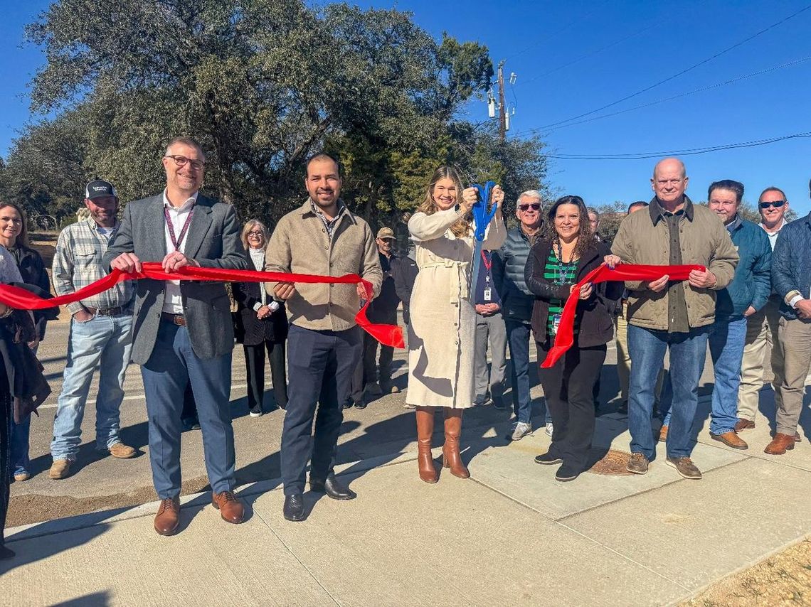 Submitted Photo WSD Superintendent Dr. Greg Bonewald, left, Hays County Commissioner Morgan Hammer, center, and Mayor Jim Chiles, right, along with city council members and other well-wishers during the dedication.