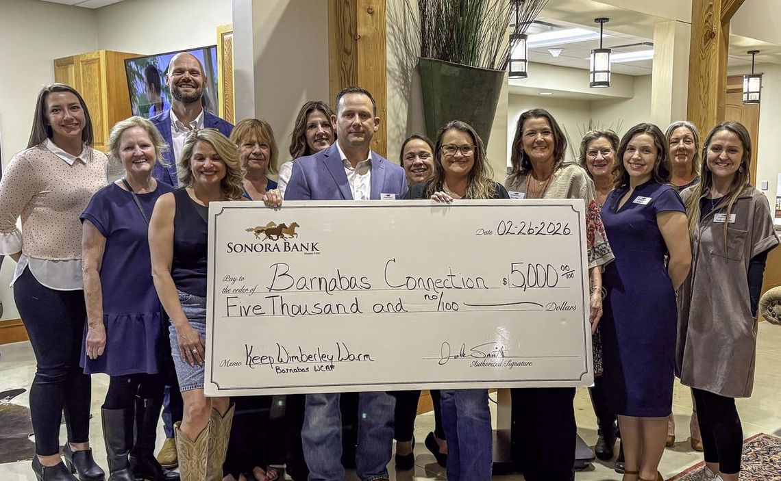 Sonora Bank shows support for Keep Wimberley Warm program Photo by Teresa Kendrick Josh Smith of Sonora Bank donates $5,000 to the Barnabas Connection “Keep Wimberley Warm” program.