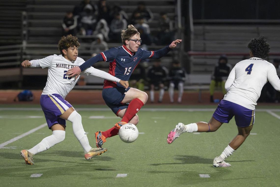 Hunter Hodgson moves the ball in the air during the Texans home game against Marble Falls.  Photo by Julie Albini/albini.smugmug.com
