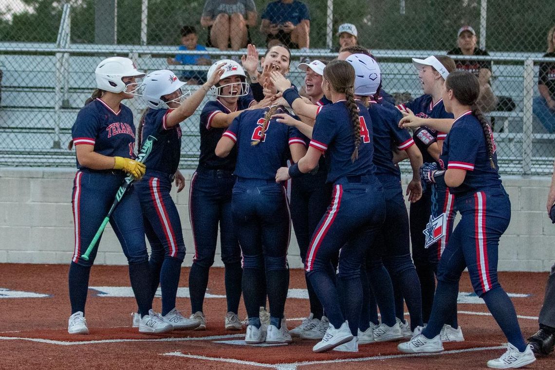 Texans win first home game over Bastrop Photo by Paul Mayhew/paulmayhewphotography.com Teammates celebrate Ella Patek’s homerun.