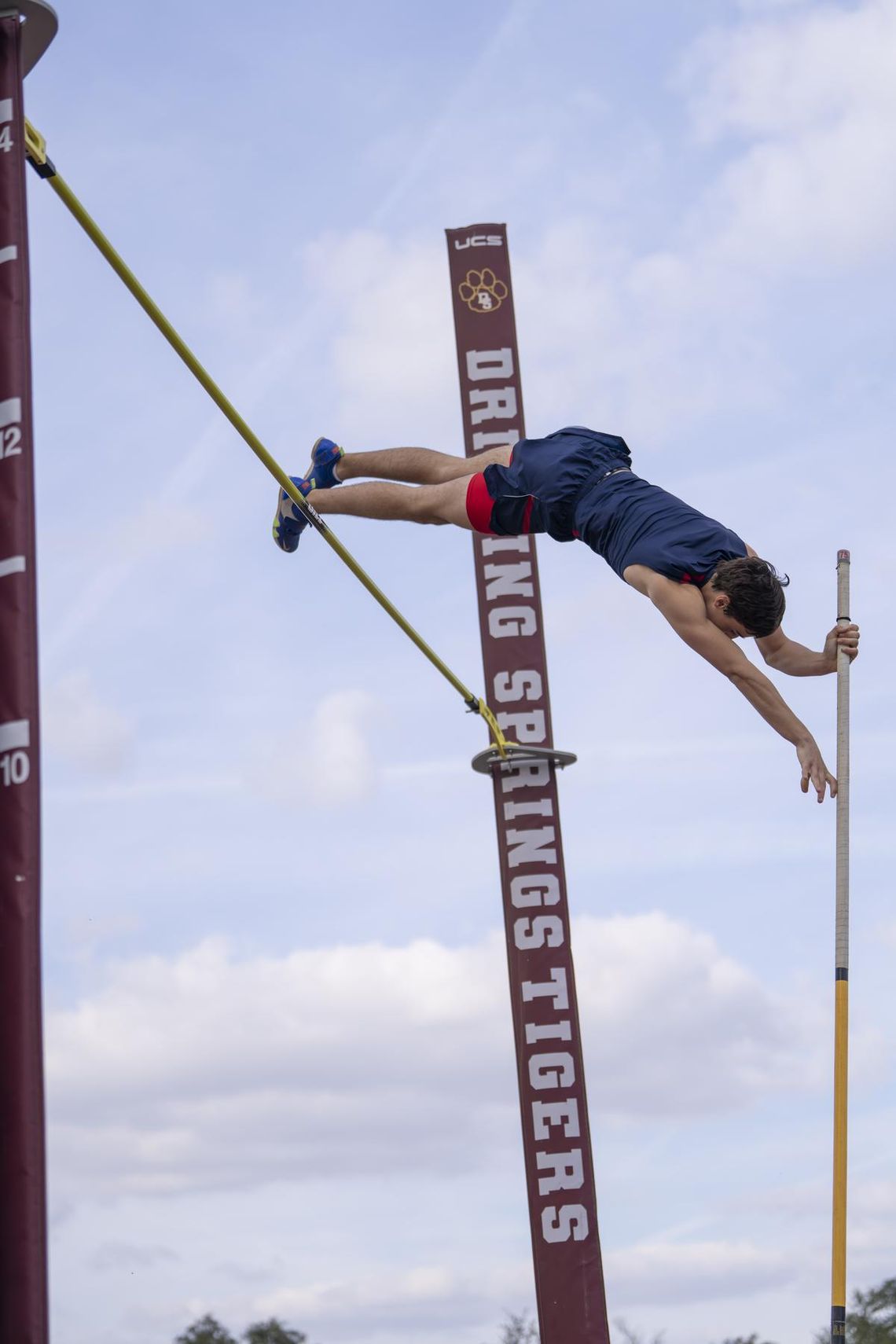 Photo by Julie Albini/albini.smugmug.com Dane Mignerey takes first place in the pole vault. 