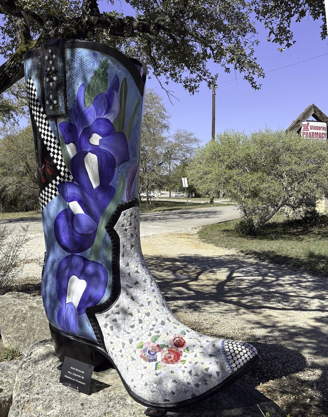 Sporting fresh mosaic tiles, the Boot outside the Wimberley Pharmacy has been restored by JoDee BEnson. Photo by Teresa Kendrick