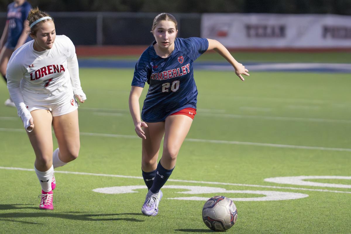 Photo by Julie Albini/albini.smugmug.com Emma Durkin, #20, directs the ball d...