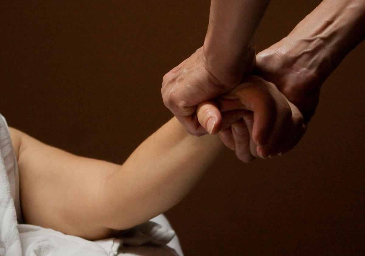 Godwin treats a client with lymphedema. Submitted Photo.