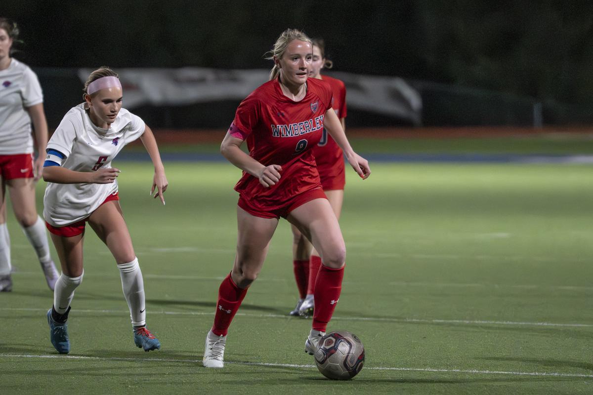 Dylan Watson #8 looks for the open teammate.  Photo by Julie Albini/albini.sm...