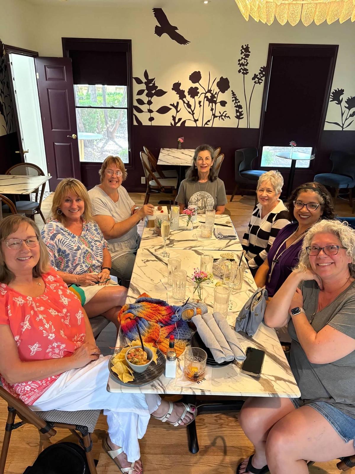 Photo by Ronda VanDyk Frolicking Lamb knitters and crocheters gather at their...