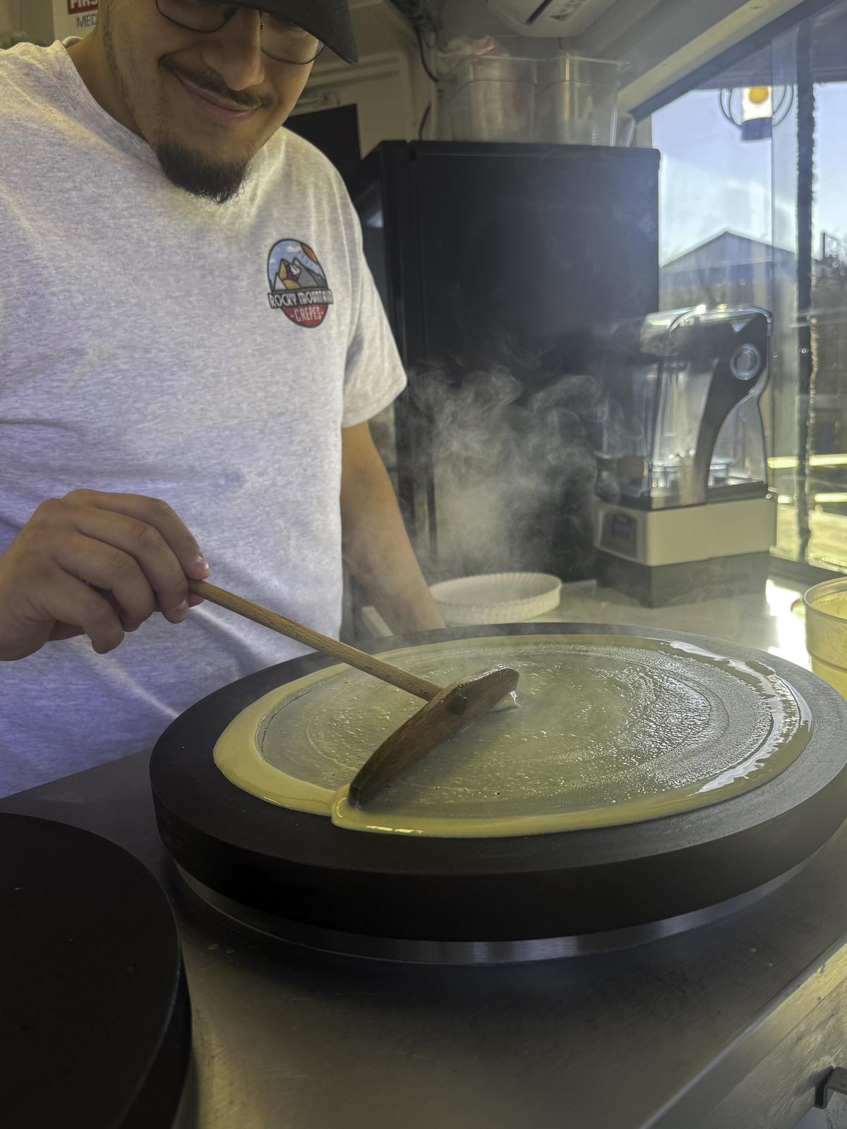 Photo by Trevor Airola Employee Jose Garza spins batter at Rocky Mountain Cre...