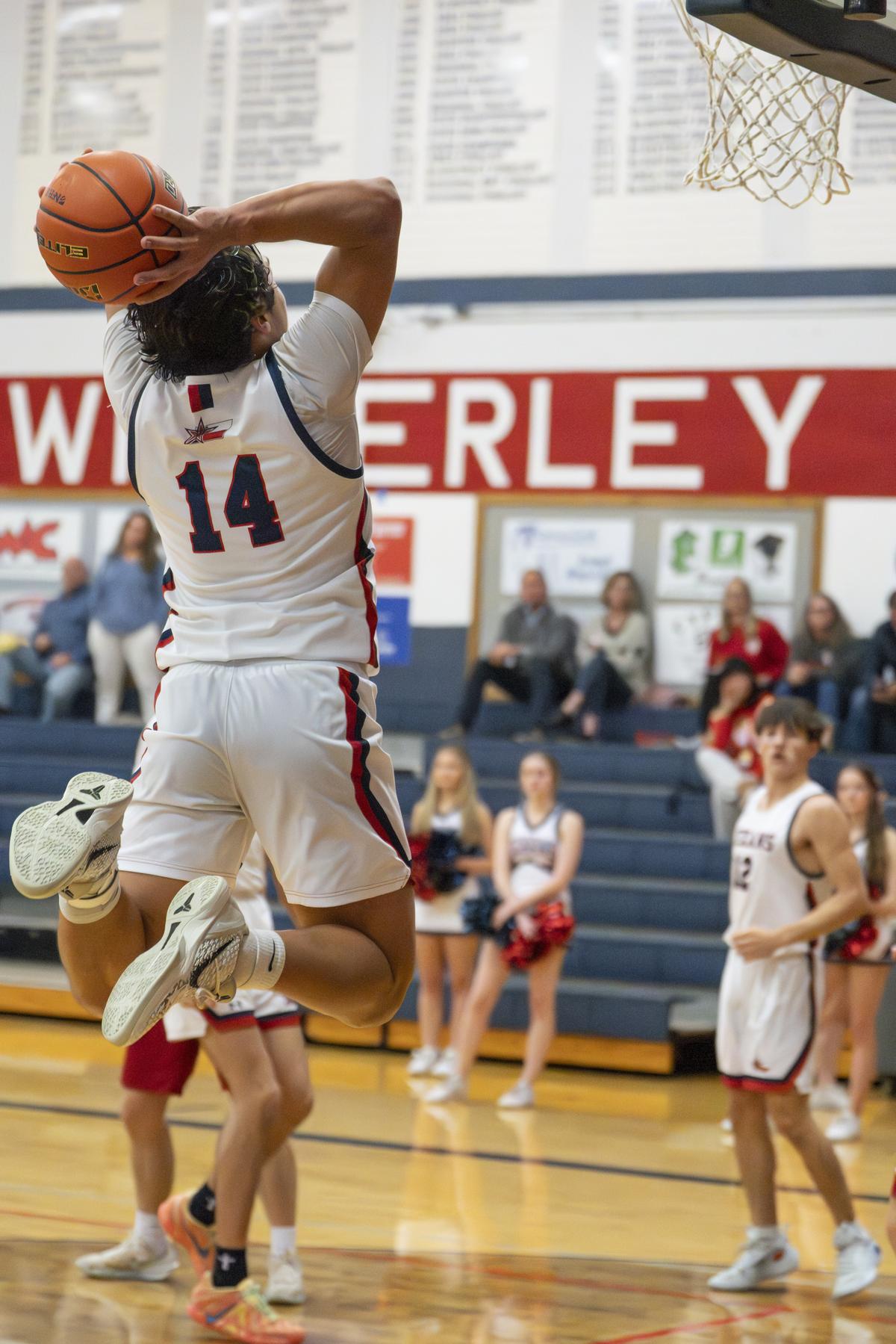 Paul Gumbert-Mendoza, #14, with point 48 of the game, a new record. Photo by...