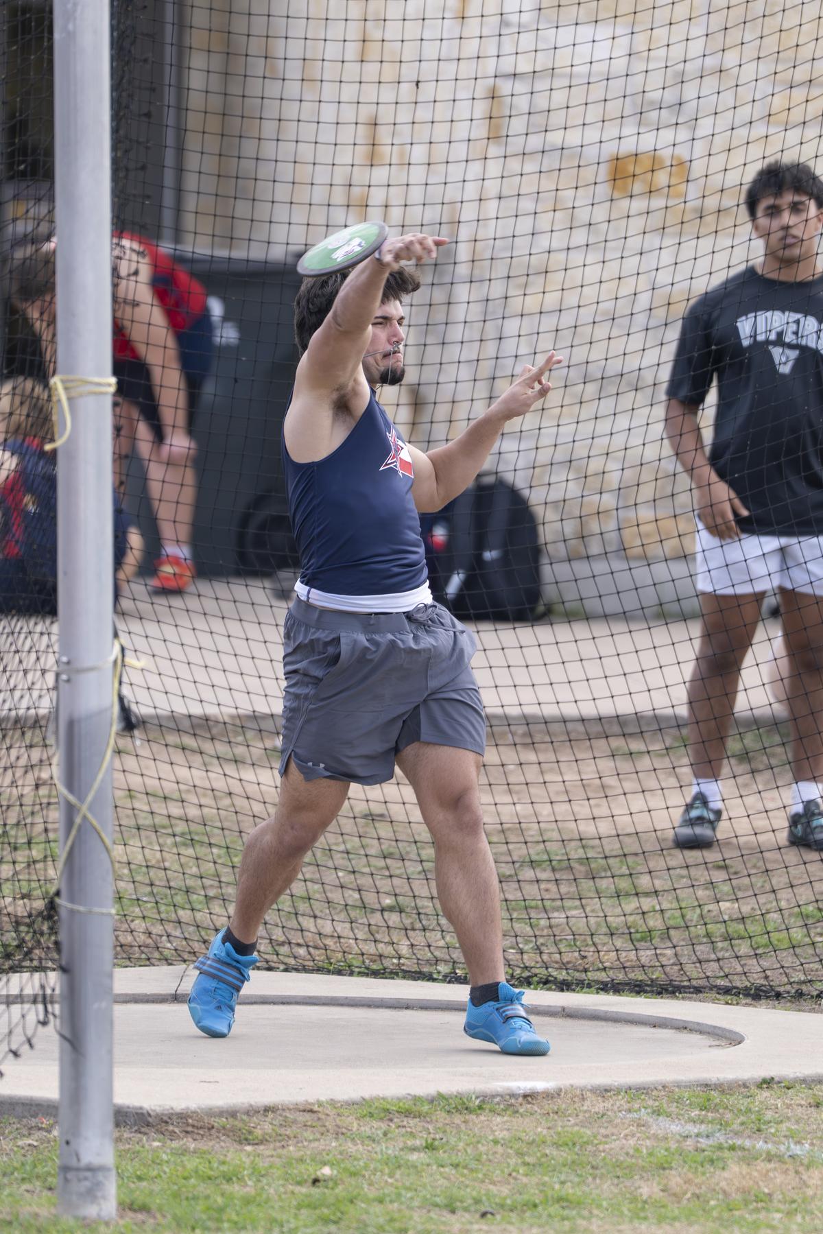 Photo by Julie Albini/albini.smugmug.com Maverick Jacobs throws the discus.