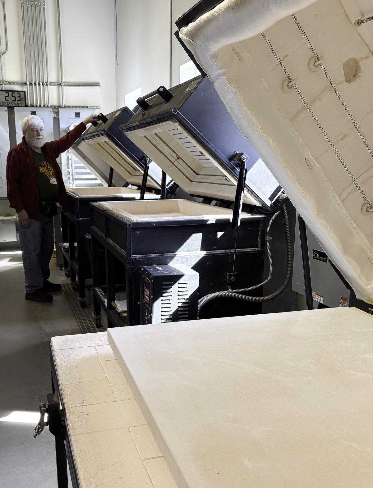 Photo by Teresa Kendrick Chester John at several of the kilns: Big Brother, T...