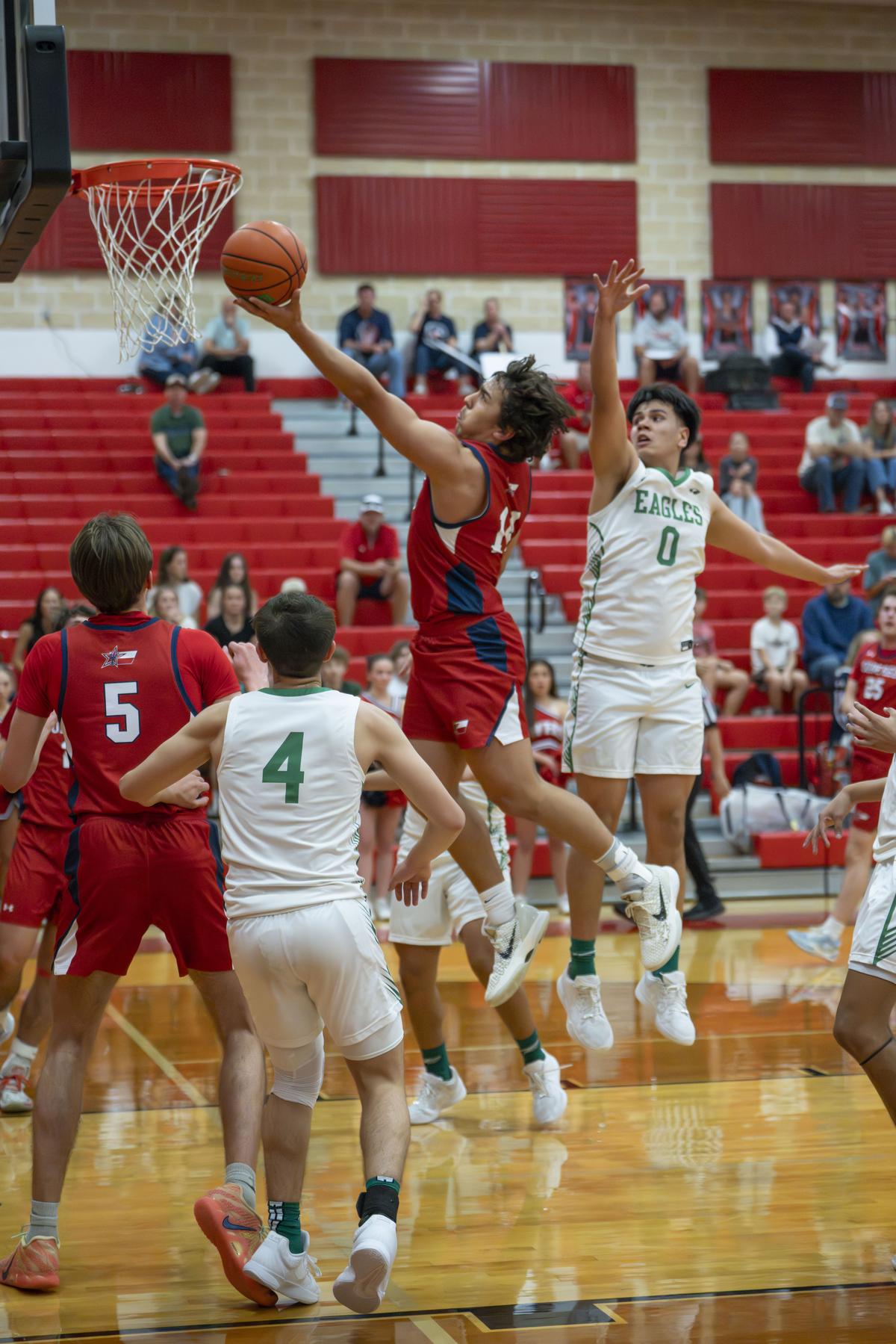 Photo by Julie Albini/albini.smugmug.com Paul Gumbert Mendonza up for 2 pts.