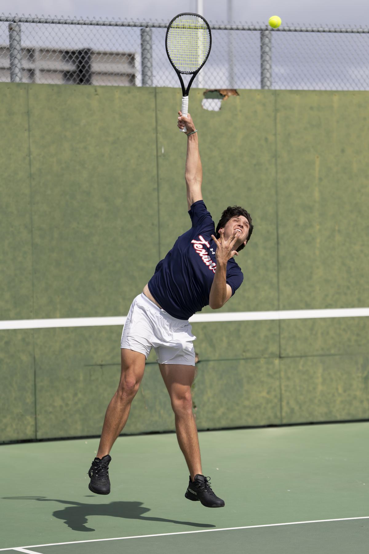 Gus Moore serves the ball in singles competition at the Pflugerville Connally...