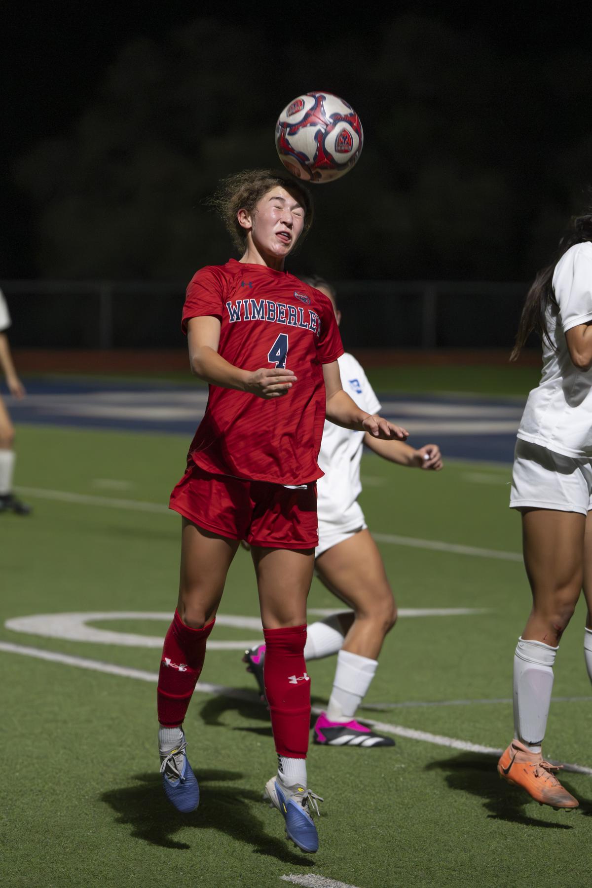 Samantha Santana, #4, uses her head. Photo by Julie Albini/albini.smugmug.com