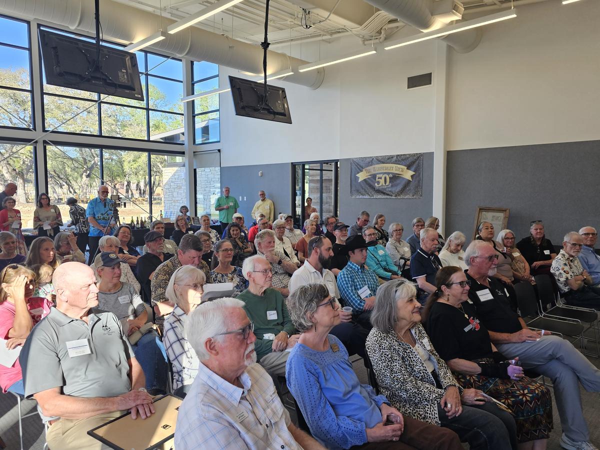 Photo by Paul Mayhew It was standing room only in the back of the room.