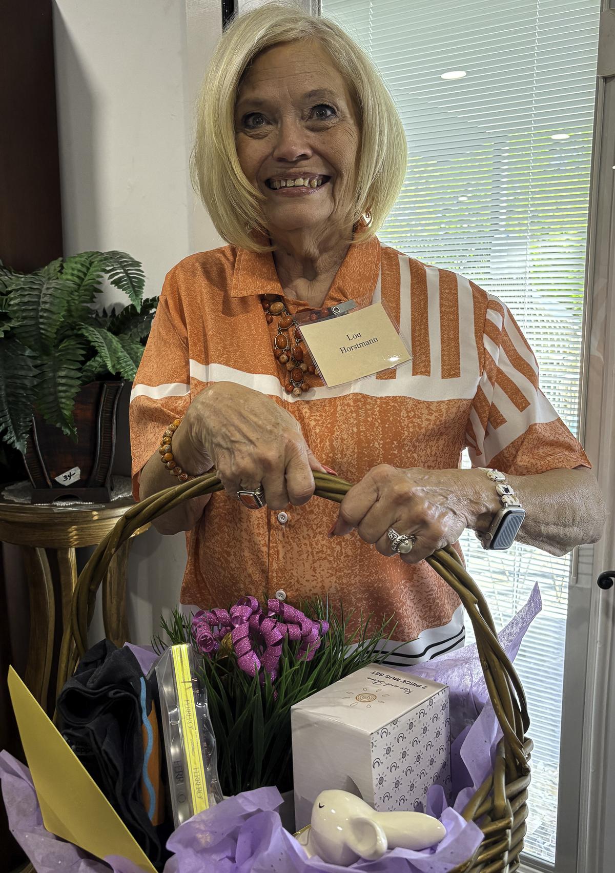 Photo by Teresa Kendrick Lou Horstmann won one of several raffle prizes durin...
